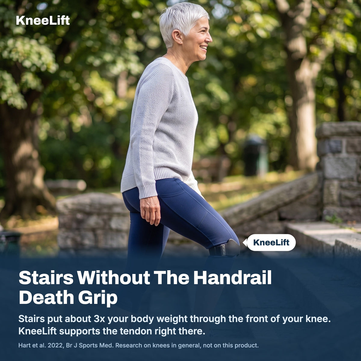 Woman climbing stairs wearing KneeLift, stairs put about 3x body weight through the front of the knee